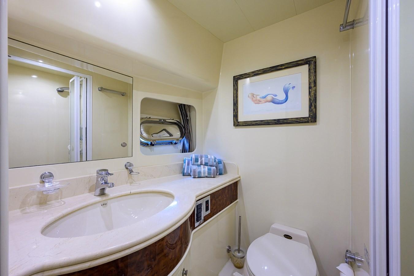 a bathroom with a sink and a mirror aboard 82 Yacht for Sale