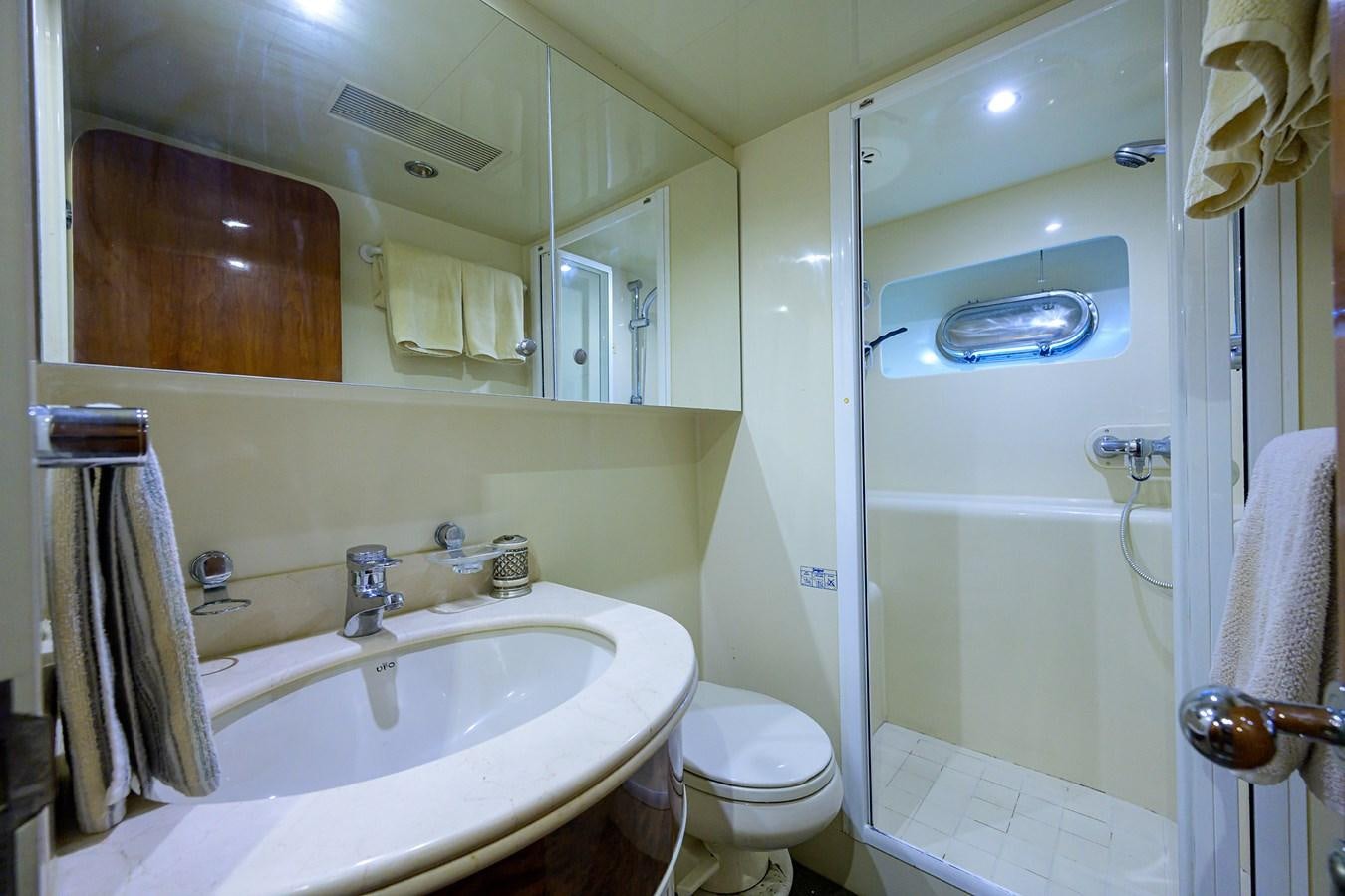 a bathroom with a sink toilet and bathtub aboard 82 Yacht for Sale