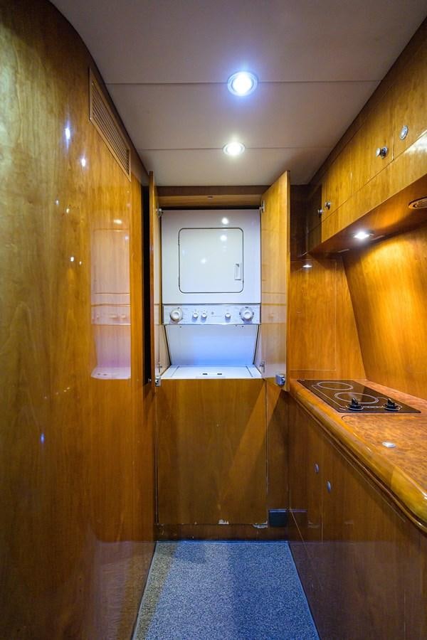 a small bathroom with a washing machine aboard 82 Yacht for Sale