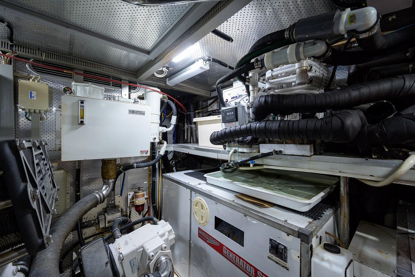 a car engine with a few parts aboard 82 Yacht for Sale