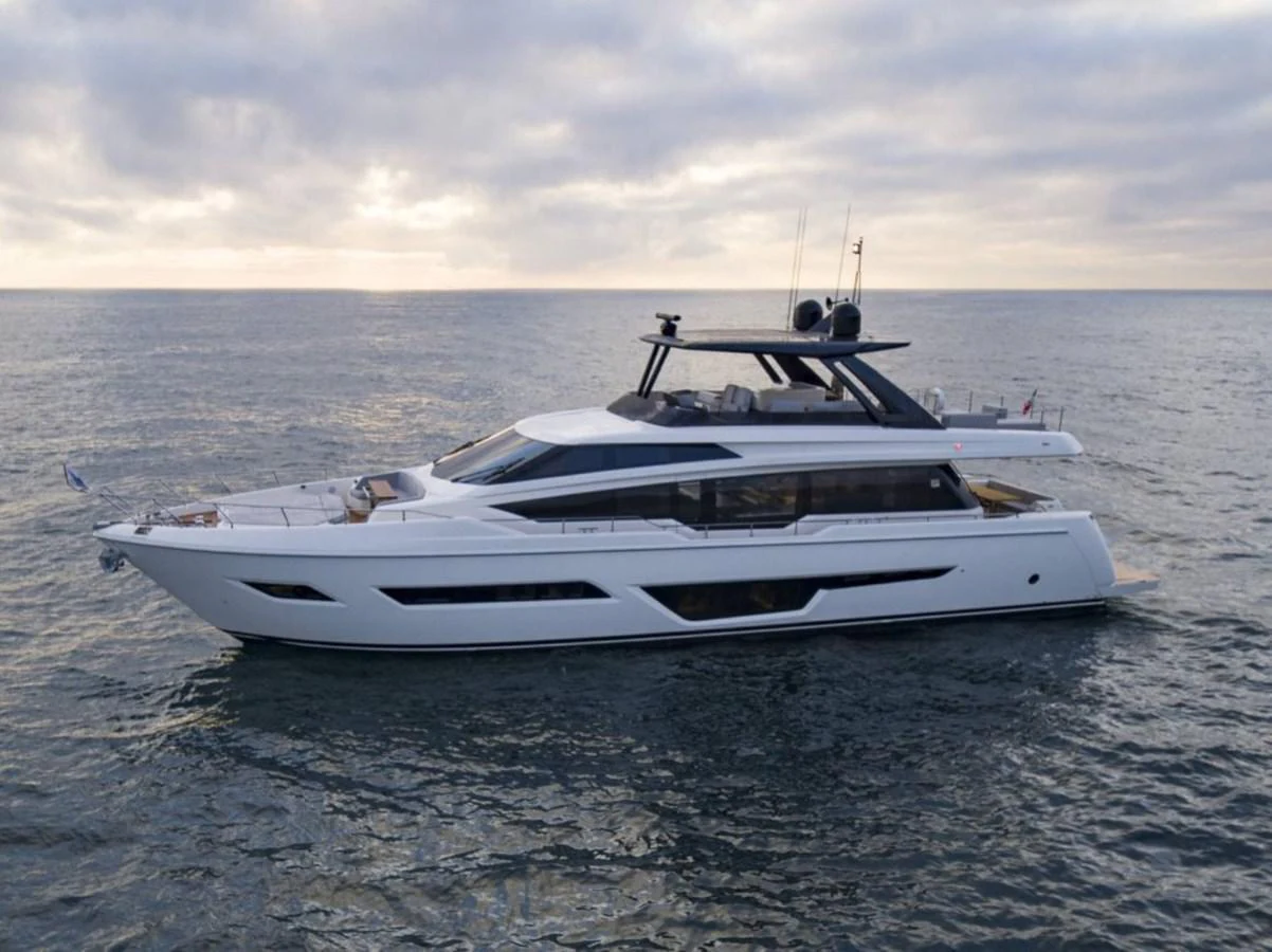 a white yacht in the water aboard 5 PALMS Yacht for Sale
