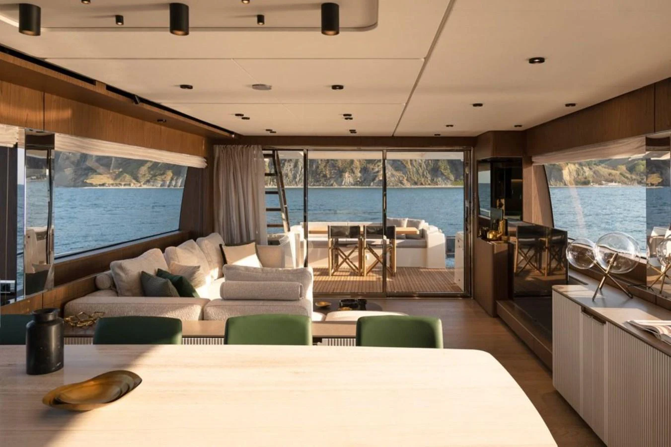 a living room with a large window aboard 5 PALMS Yacht for Sale