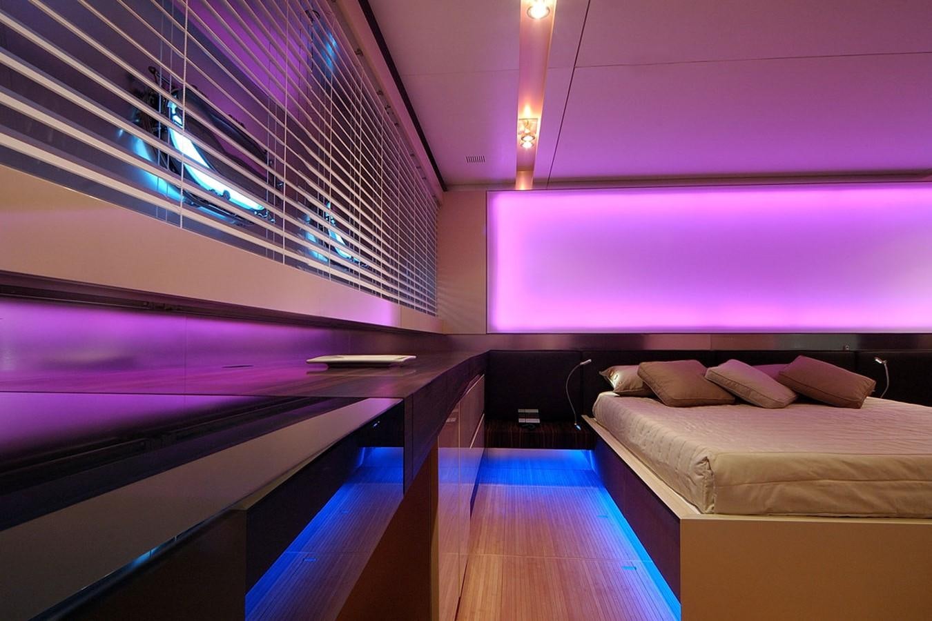 a room with a bed and a window aboard MIKYMAR Yacht for Sale