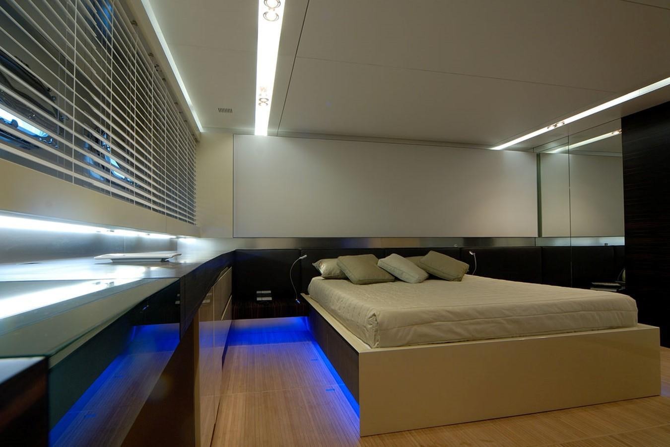 a room with a bed and a desk aboard MIKYMAR Yacht for Sale