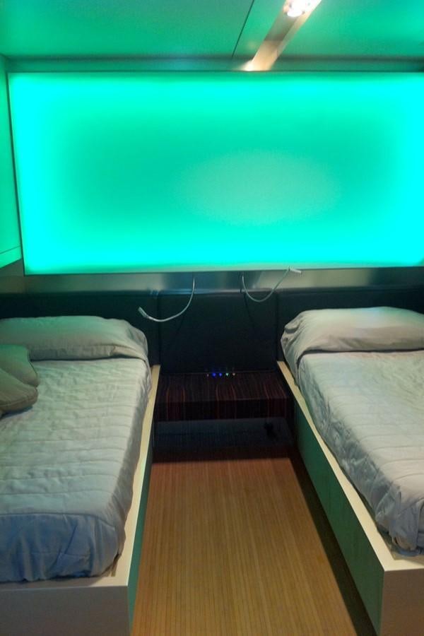 a room with two beds aboard MIKYMAR Yacht for Sale