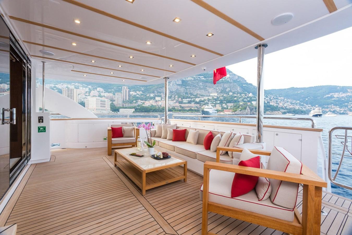 a room with a table and chairs aboard GATSBY Yacht for Sale