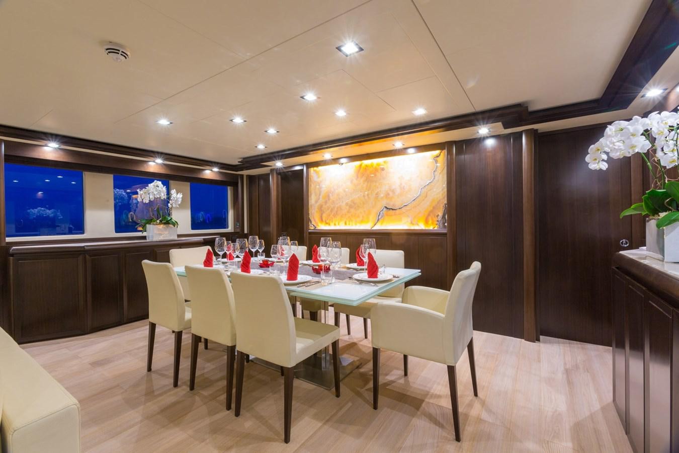 a room with a table and chairs aboard GATSBY Yacht for Sale