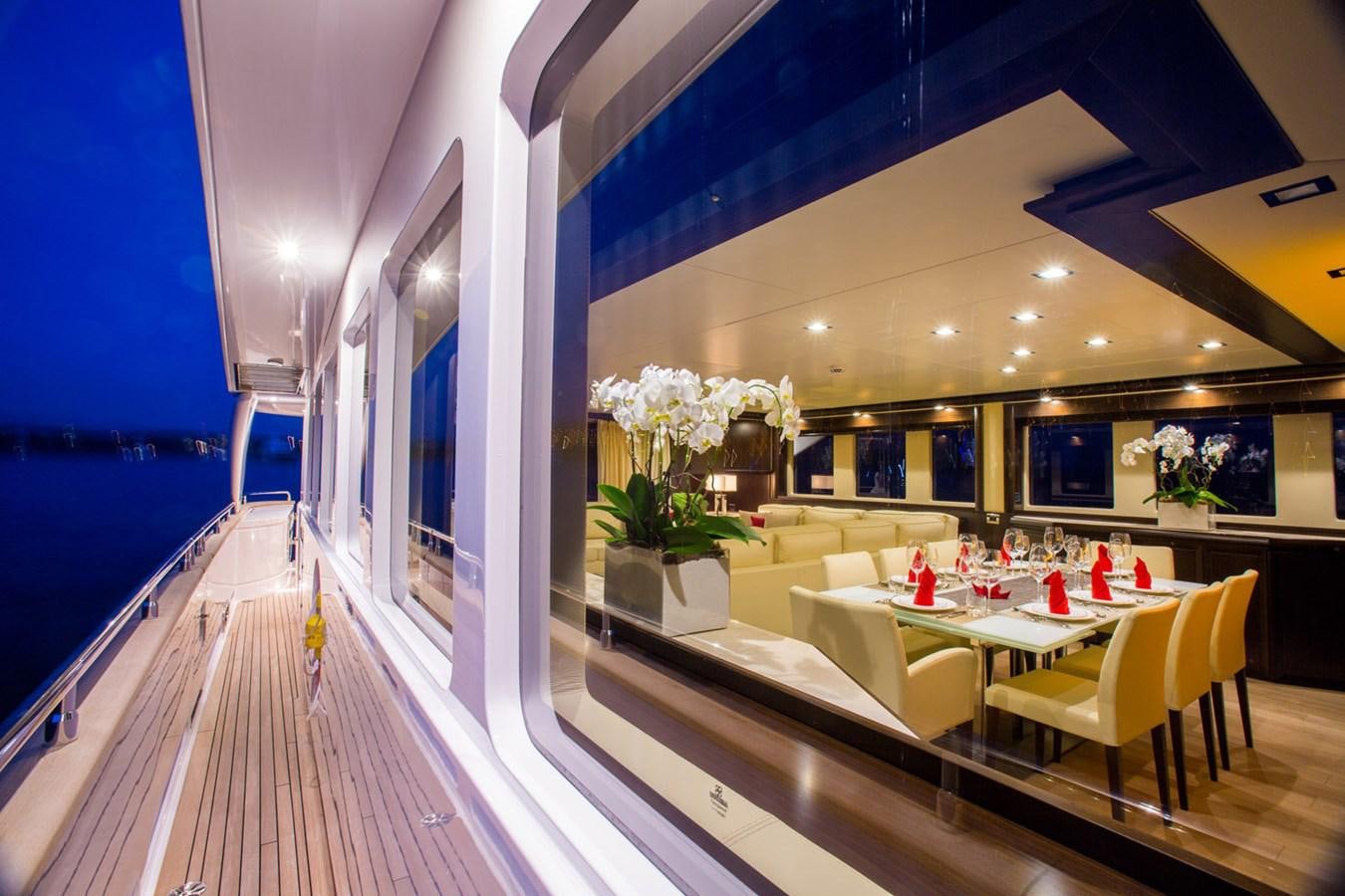a room with tables and chairs aboard GATSBY Yacht for Sale