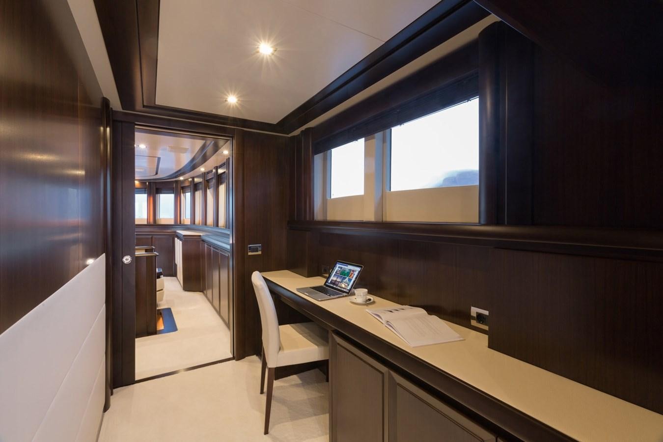a room with a desk and a laptop aboard GATSBY Yacht for Sale