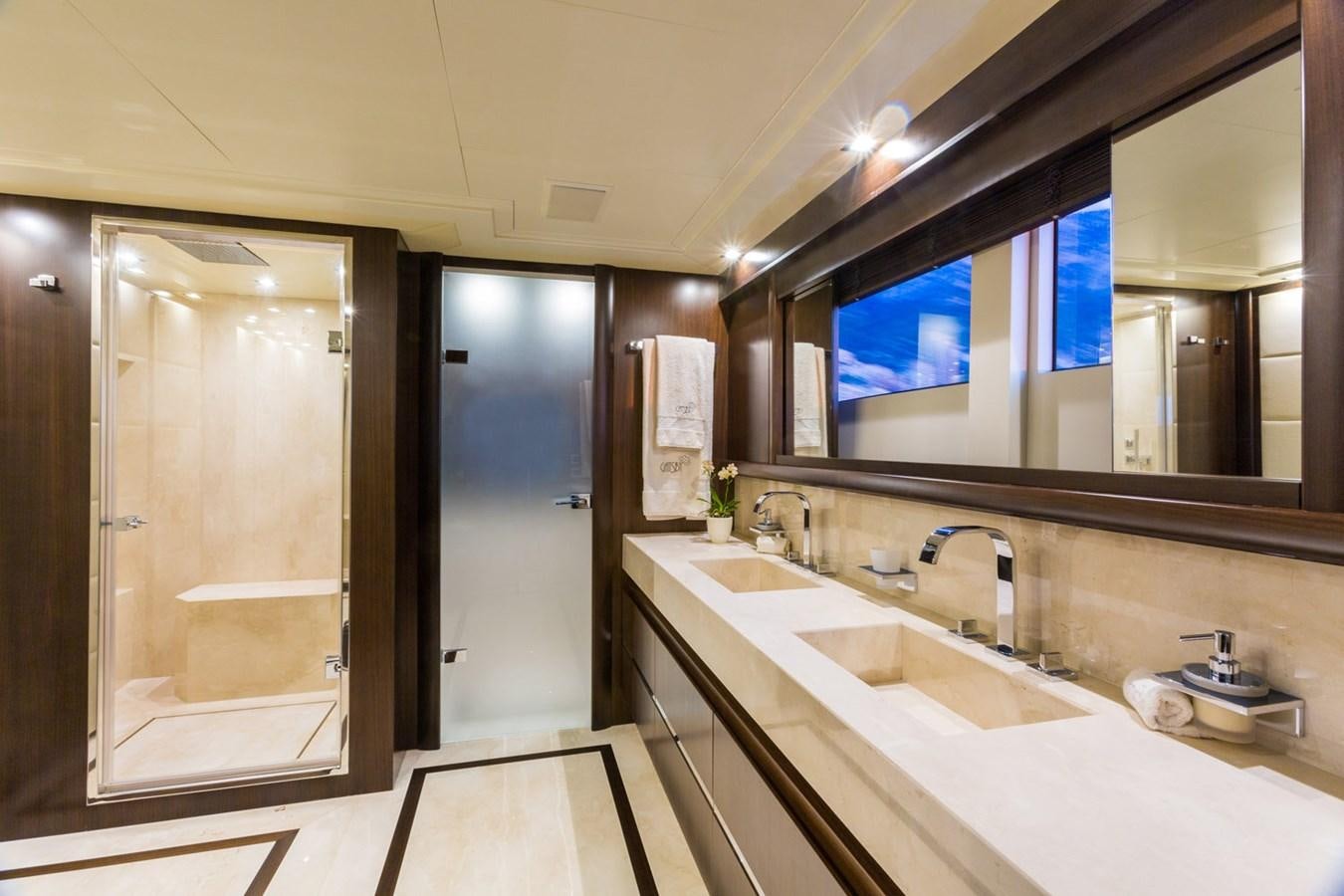 a bathroom with sinks and mirrors aboard GATSBY Yacht for Sale