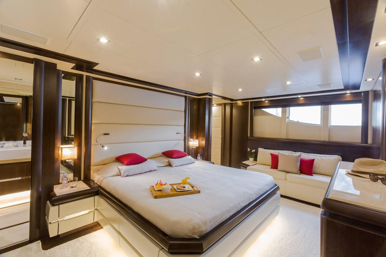 a room with a bed and a desk aboard GATSBY Yacht for Sale