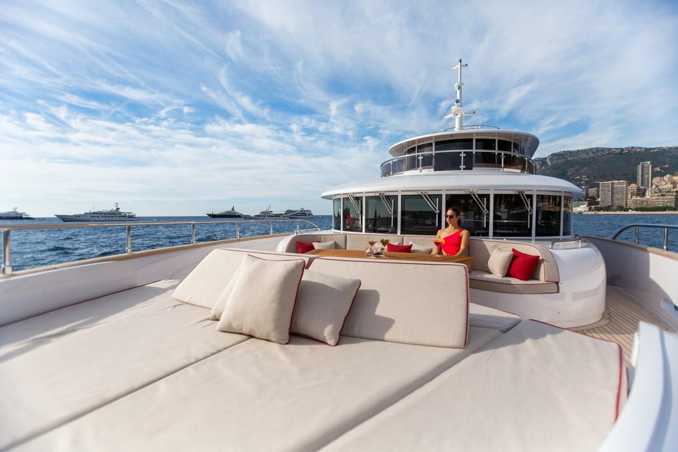 a person sitting on a couch on a boat aboard GATSBY Yacht for Sale