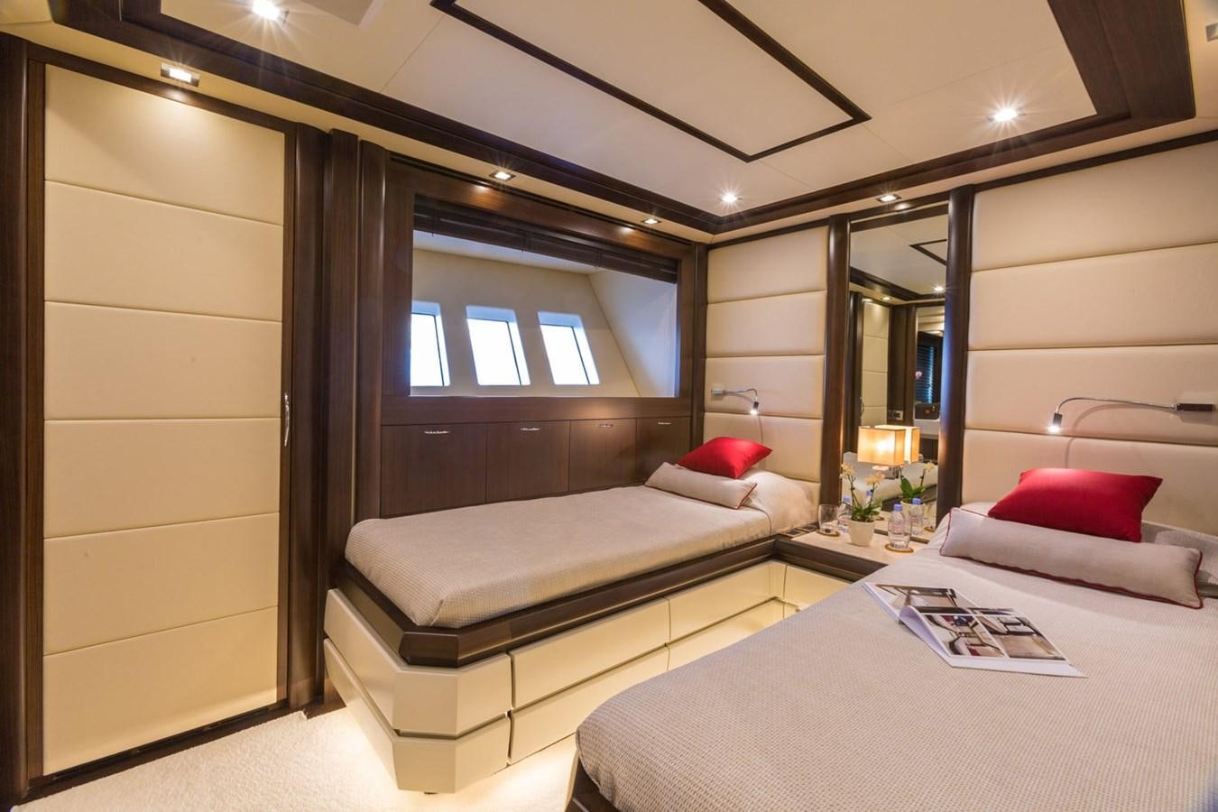a room with a bed and a mirror aboard GATSBY Yacht for Sale