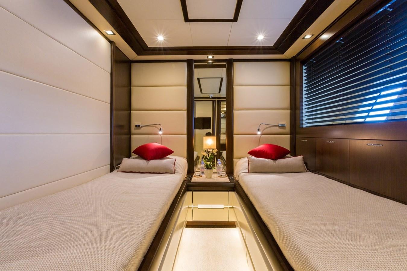 a room with a bed and a mirror aboard GATSBY Yacht for Sale
