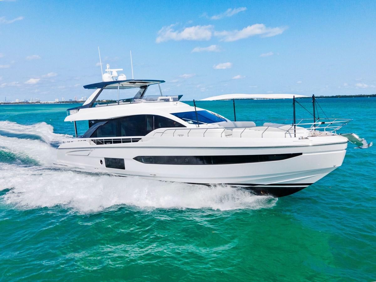 a white boat in the water aboard NENA Yacht for Sale
