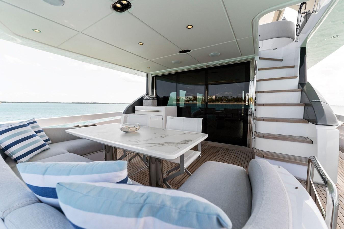 a room with a table and chairs aboard NENA Yacht for Sale