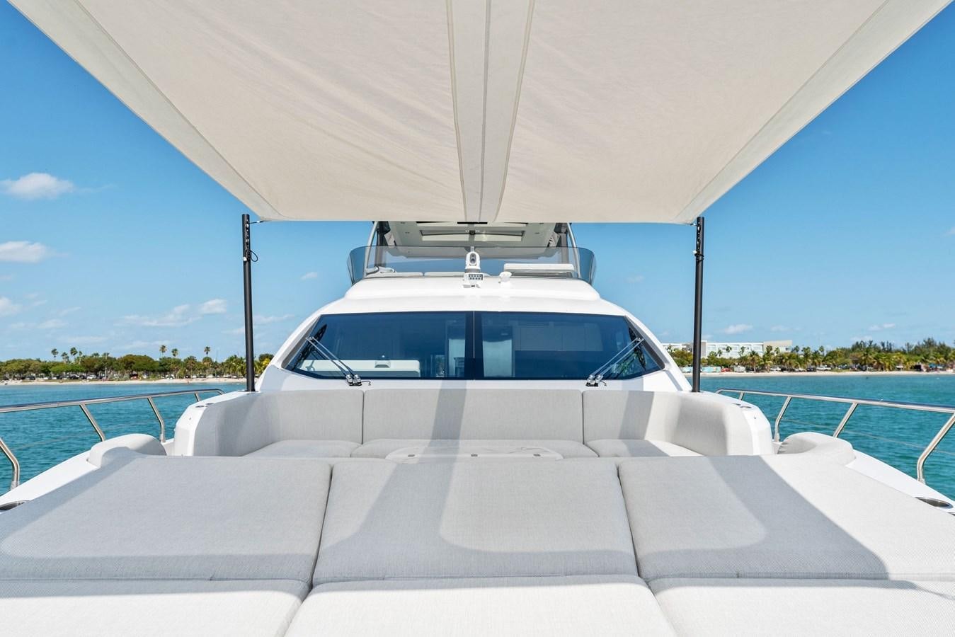 a white car on a boat aboard NENA Yacht for Sale