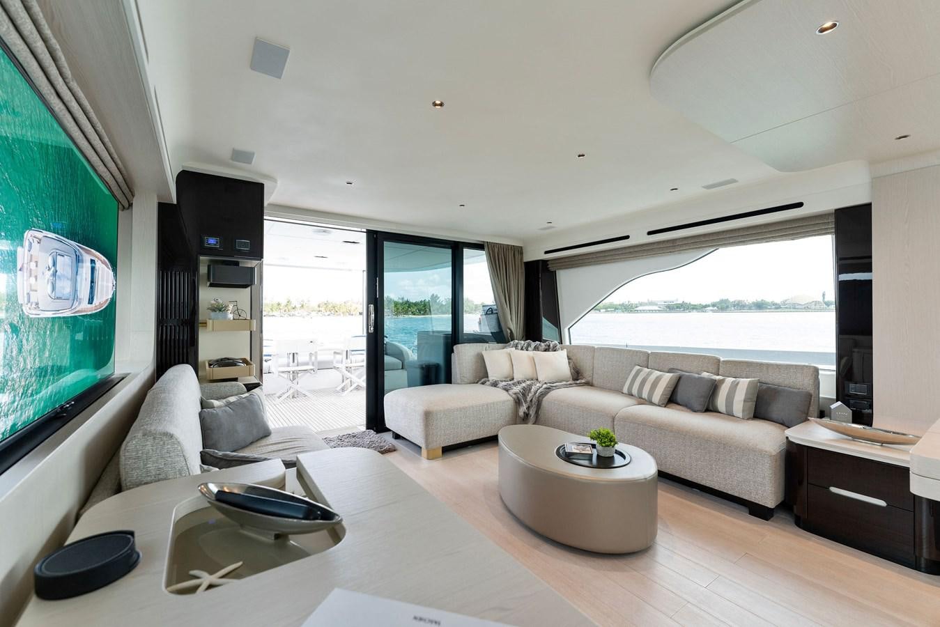 a living room with a large window aboard NENA Yacht for Sale