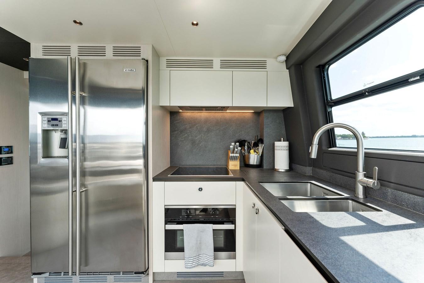 a kitchen with stainless steel appliances aboard NENA Yacht for Sale