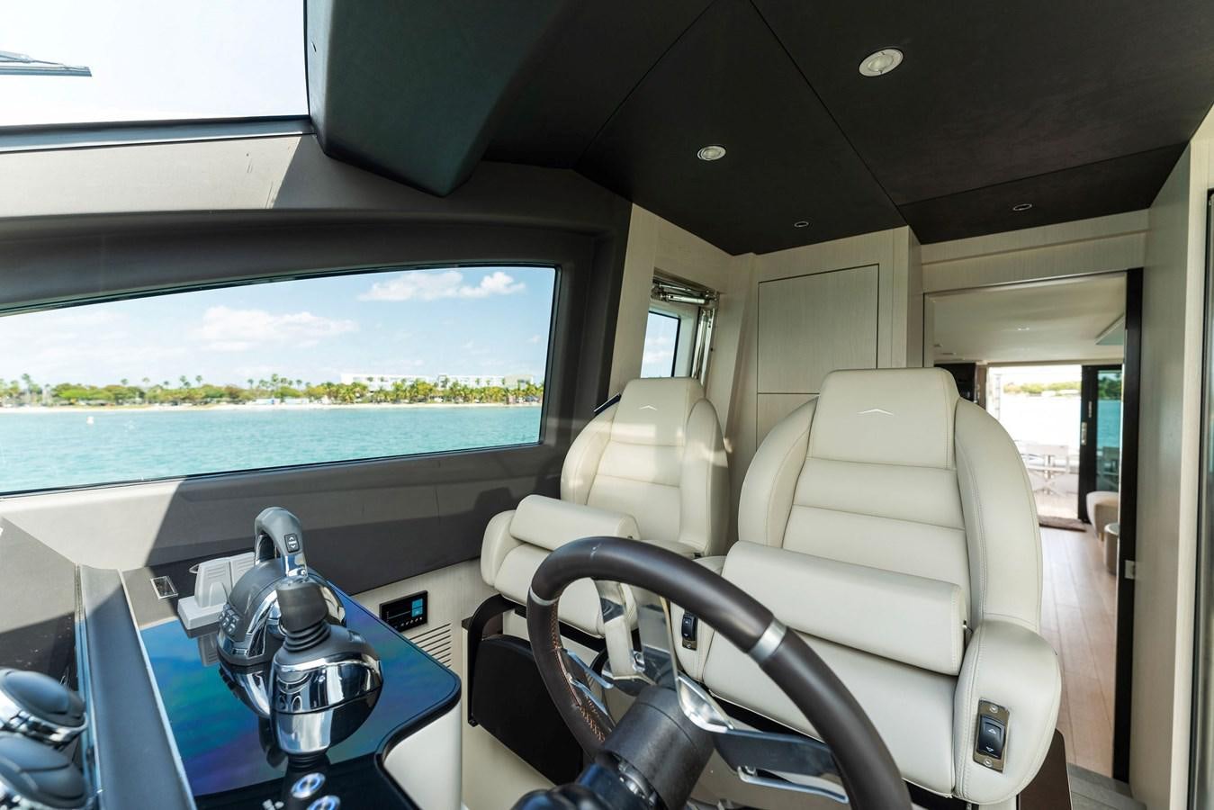 inside of a vehicle with a window and a view of the land aboard NENA Yacht for Sale