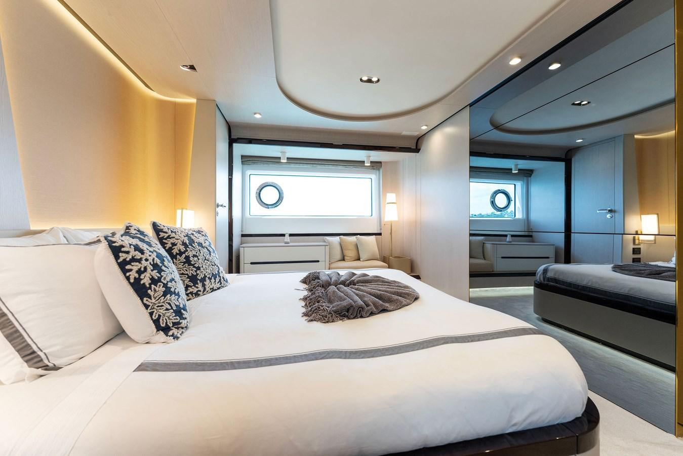 a large bed in a room aboard NENA Yacht for Sale