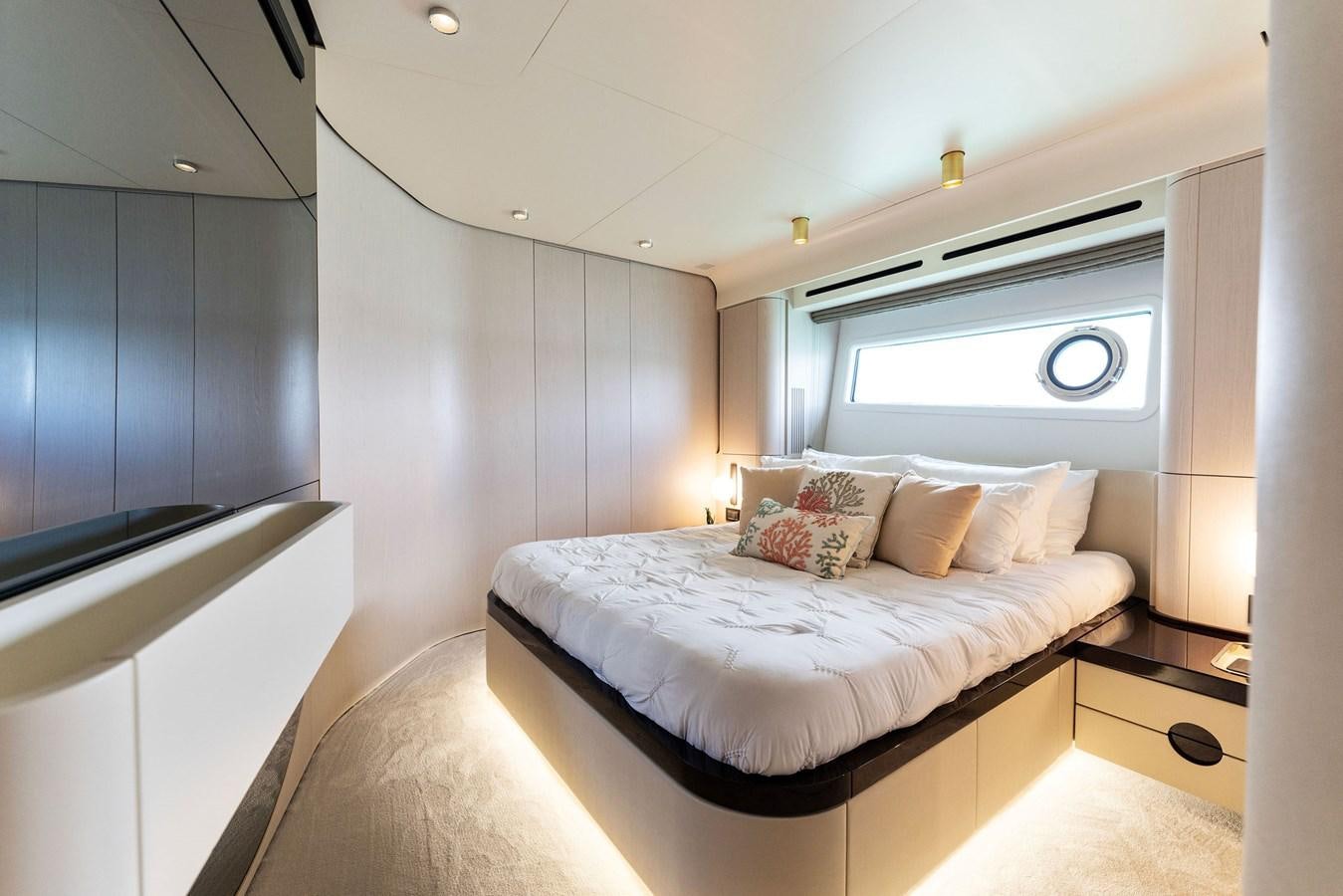 a bedroom with a bed aboard NENA Yacht for Sale