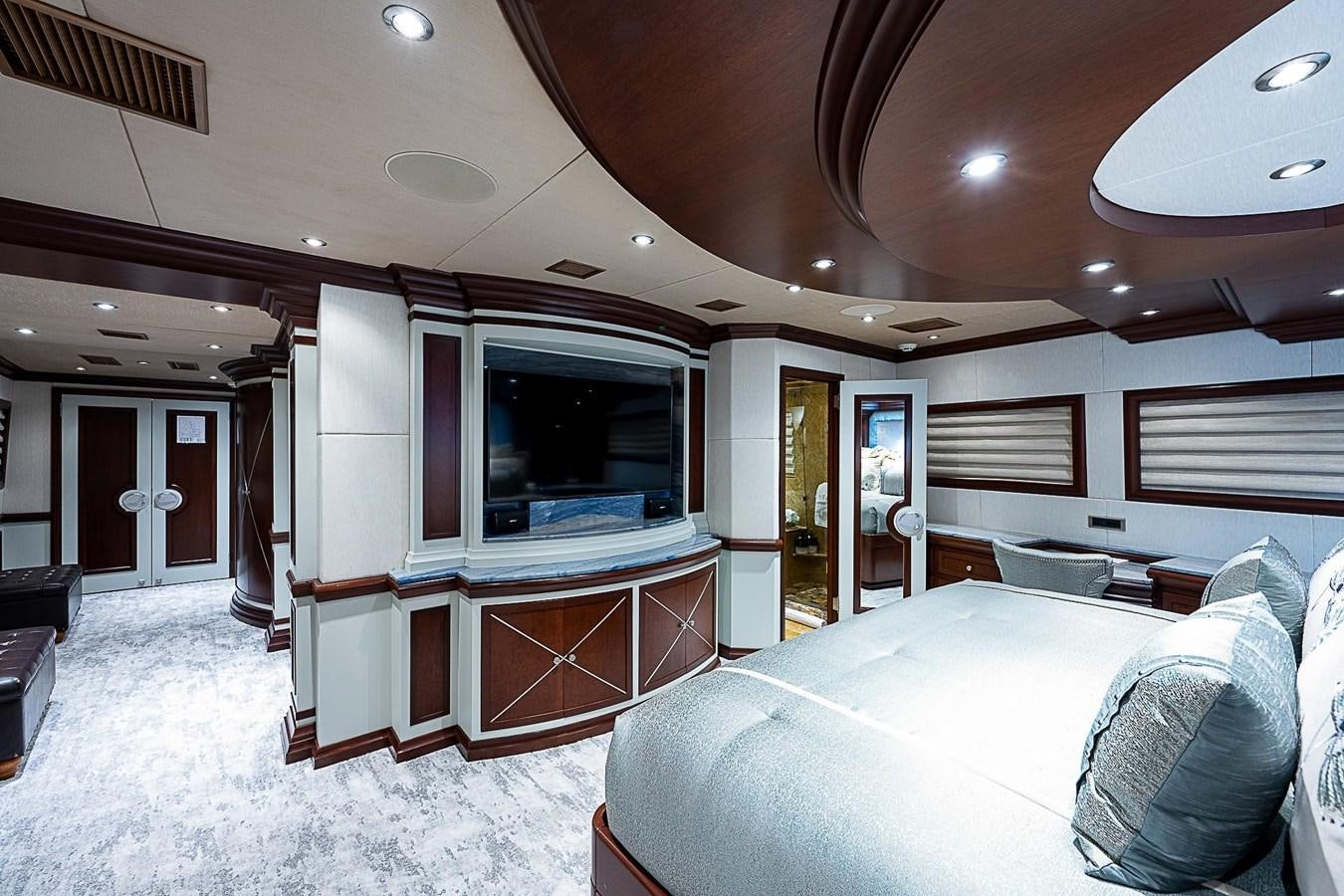 a large bedroom with a large bed aboard LAGNIAPPE Yacht for Sale