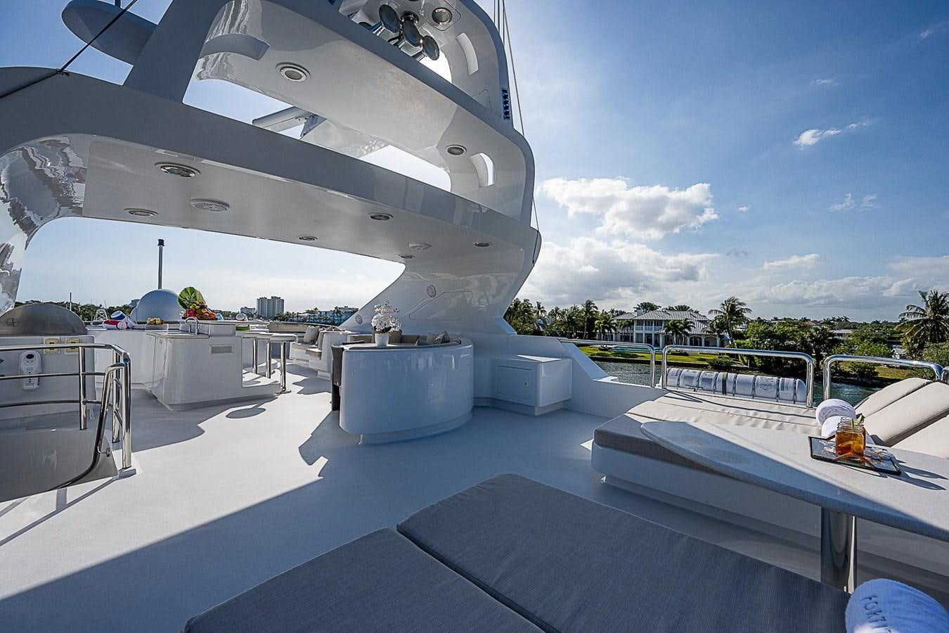 a large white building with a pool aboard LAGNIAPPE Yacht for Sale