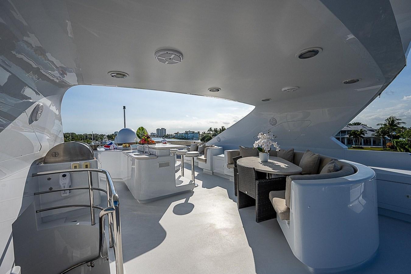 a room with a chair and a table and a large window aboard LAGNIAPPE Yacht for Sale
