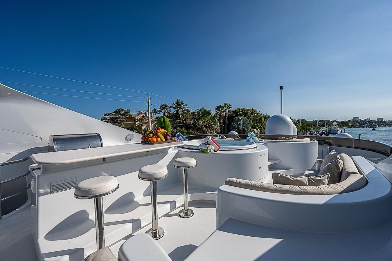 a white table with stools and chairs on it aboard LAGNIAPPE Yacht for Sale