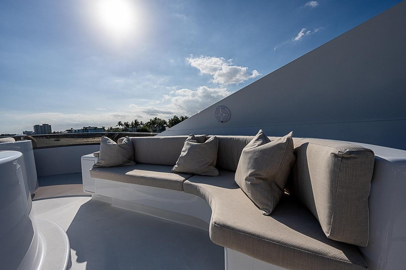 a couch with pillows on it aboard LAGNIAPPE Yacht for Sale