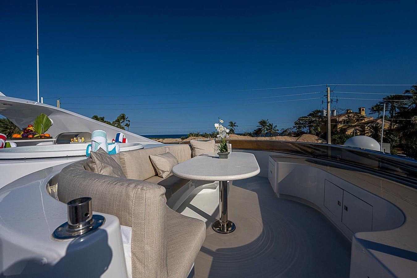 a table on a balcony aboard LAGNIAPPE Yacht for Sale
