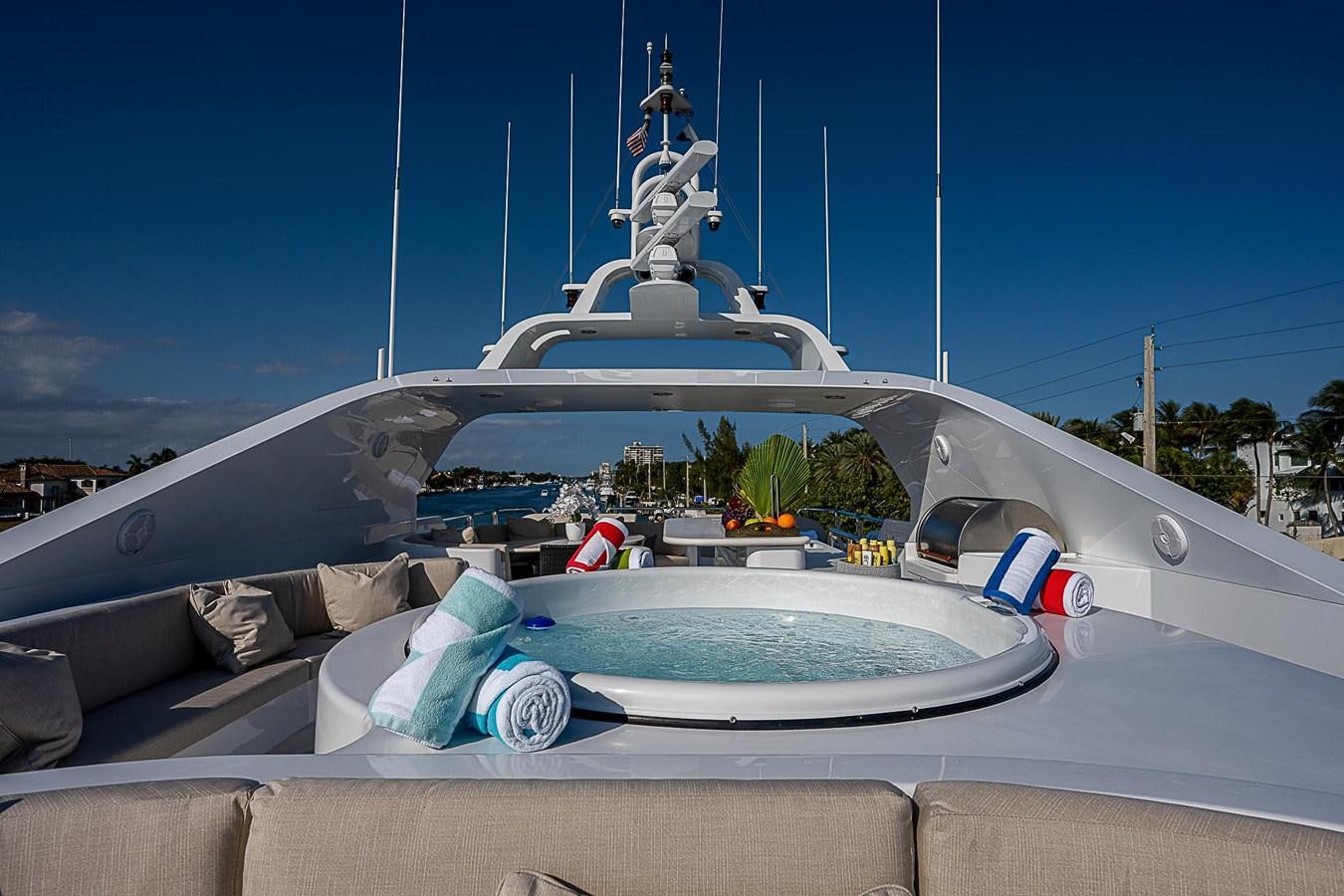 a boat with a pool and a plant in the back aboard LAGNIAPPE Yacht for Sale