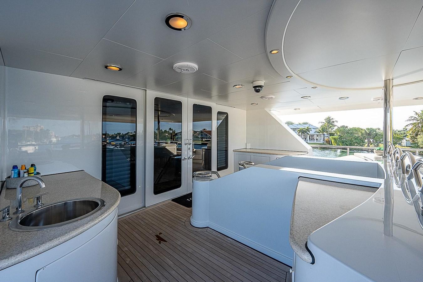 a large white bathtub in a room with a large white bed aboard LAGNIAPPE Yacht for Sale