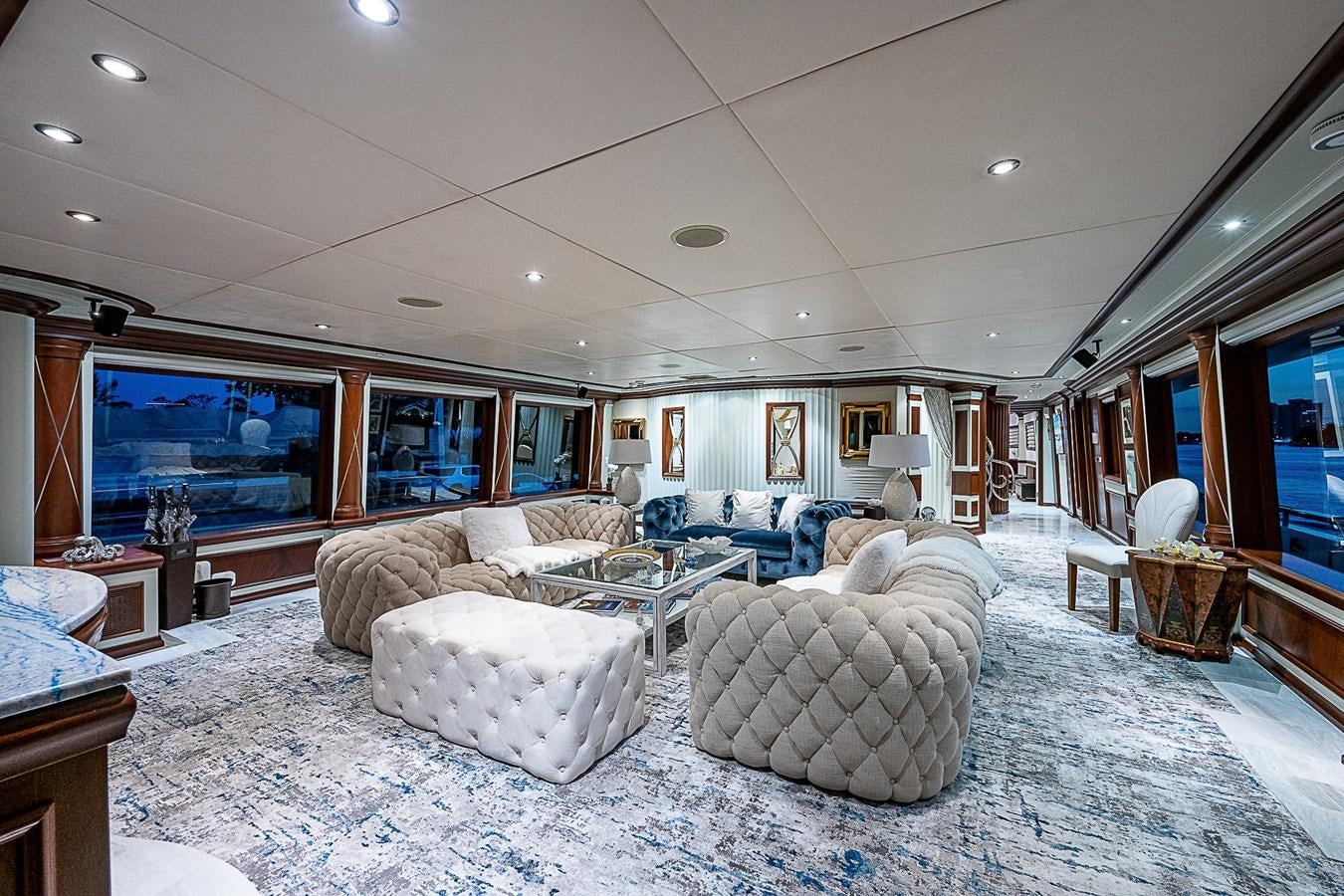 a living room with a large screen aboard LAGNIAPPE Yacht for Sale
