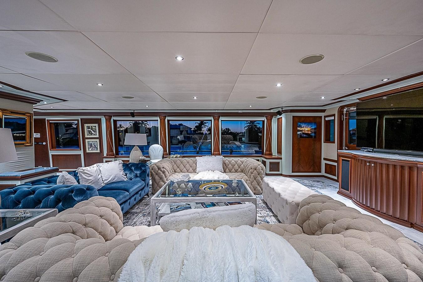 a living room with a couch and a table aboard LAGNIAPPE Yacht for Sale