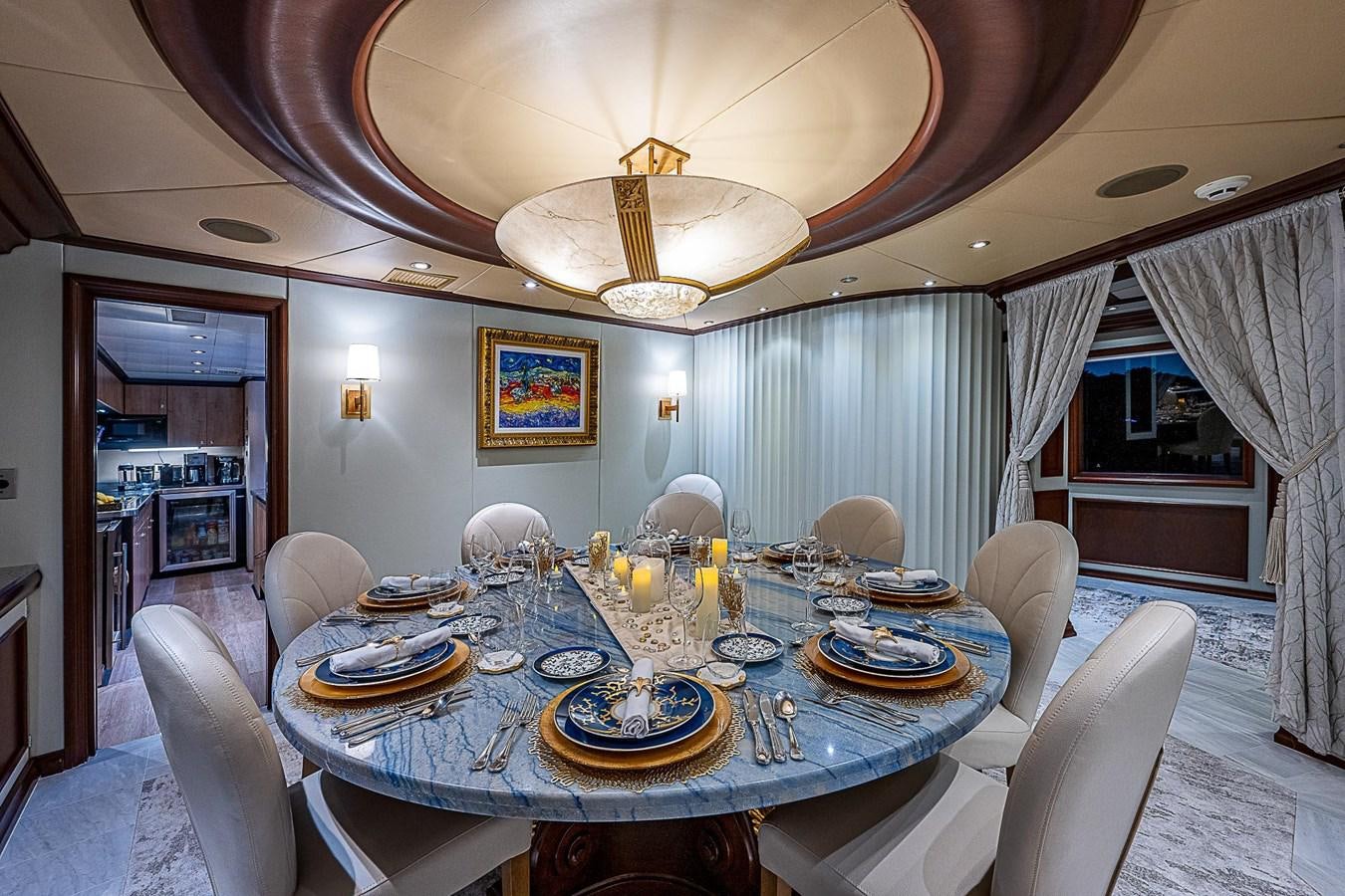 a dining room with a table set aboard LAGNIAPPE Yacht for Sale