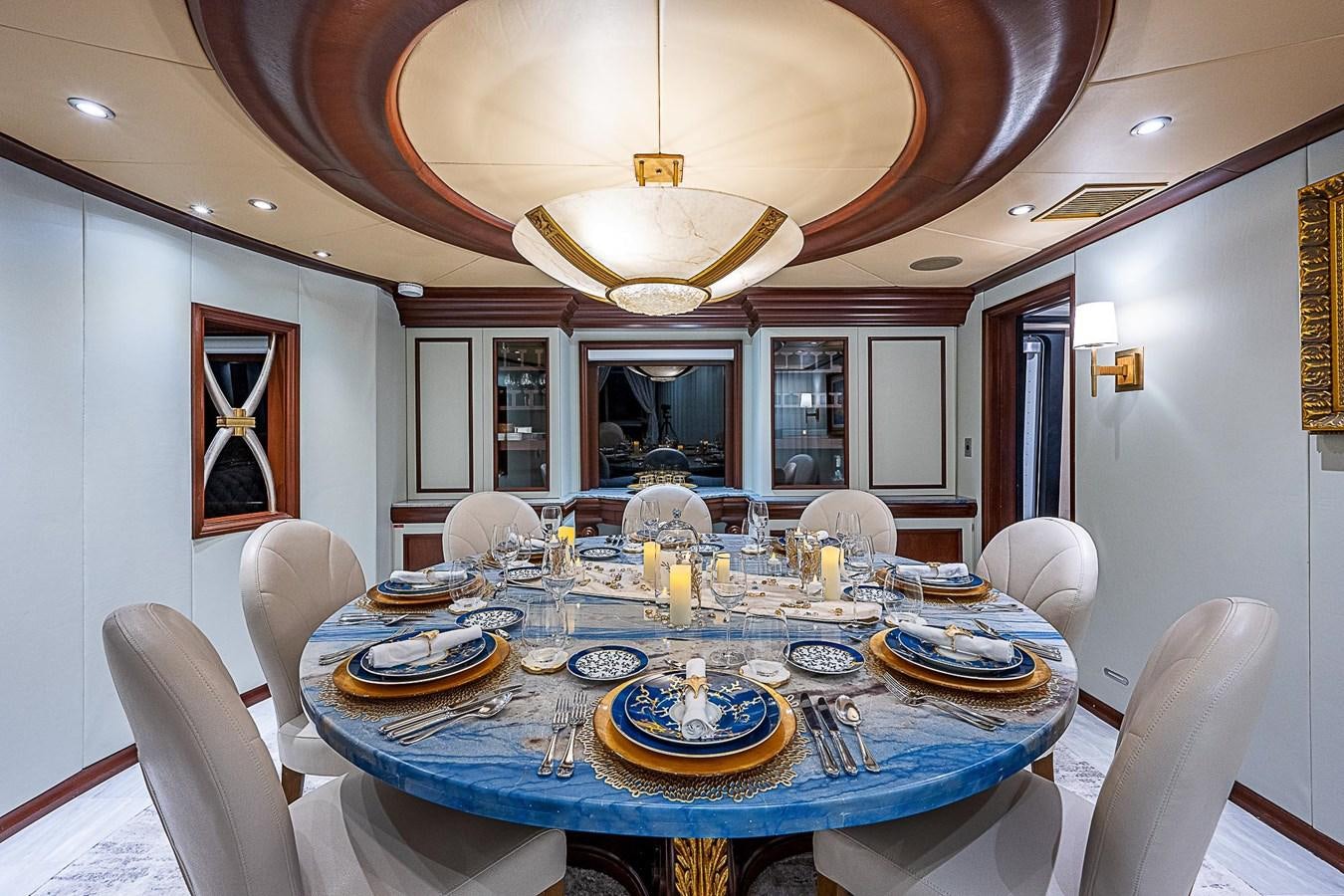 a dining room with a table set aboard LAGNIAPPE Yacht for Sale