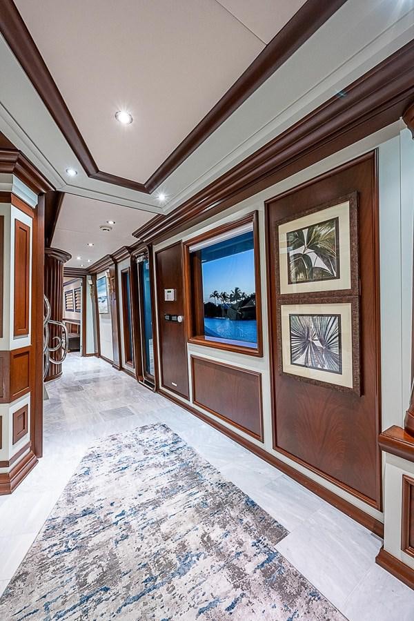 a hallway with a door and windows aboard LAGNIAPPE Yacht for Sale