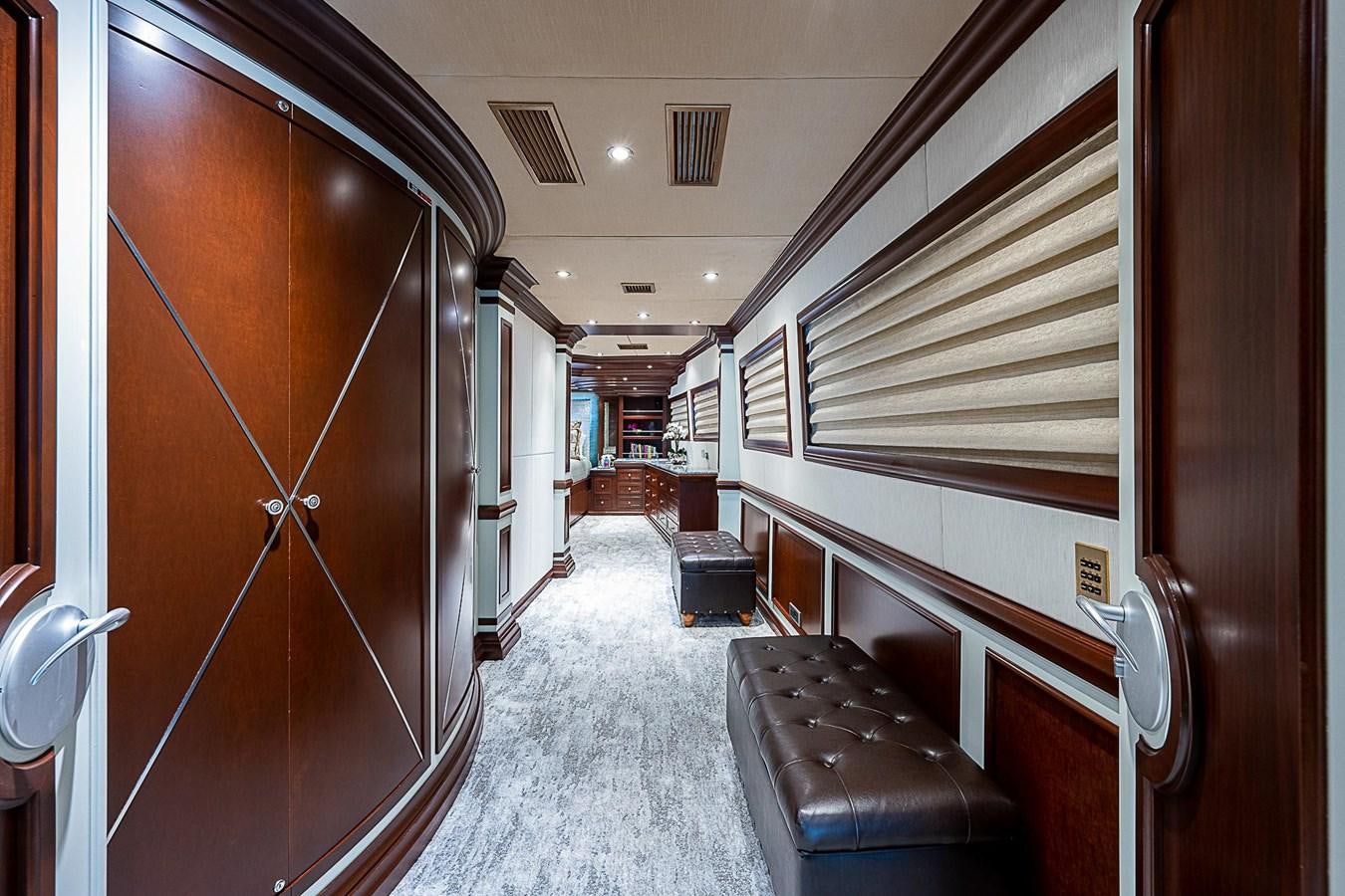 a hallway with a wood door aboard LAGNIAPPE Yacht for Sale