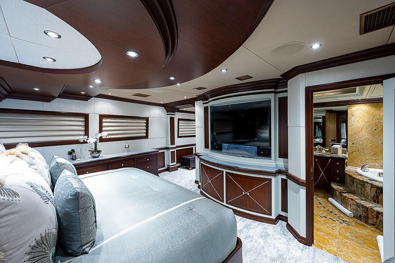 a living room with a large mirror aboard LAGNIAPPE Yacht for Sale