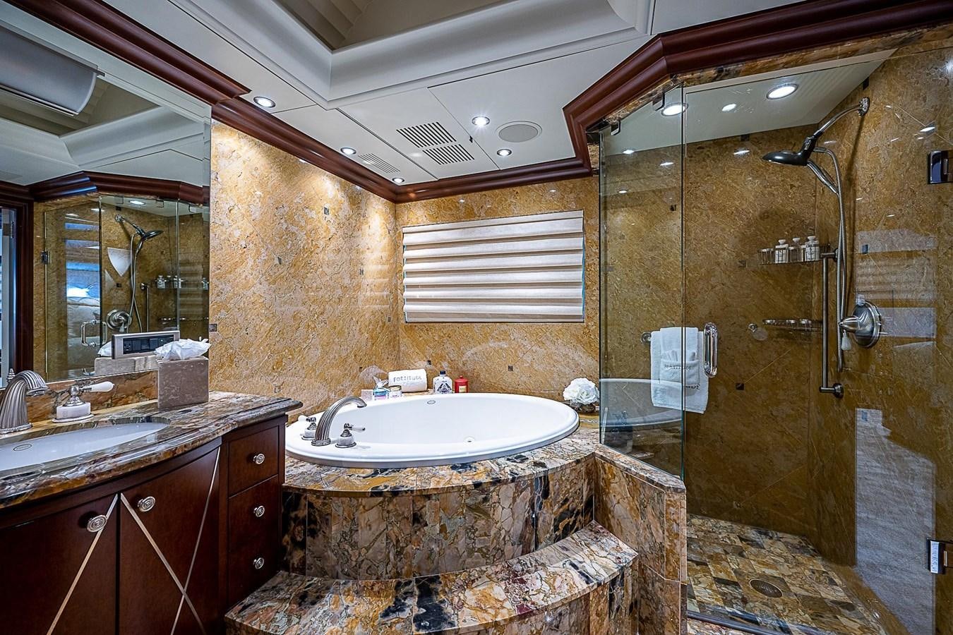 a bathroom with a marble counter top aboard LAGNIAPPE Yacht for Sale
