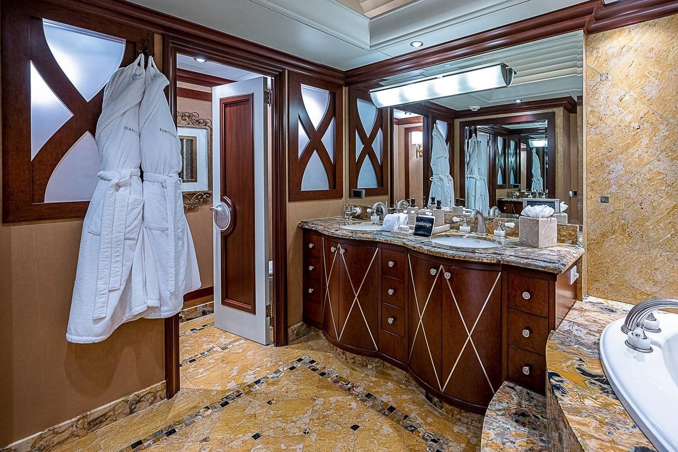 a bathroom with a sink and a mirror aboard LAGNIAPPE Yacht for Sale
