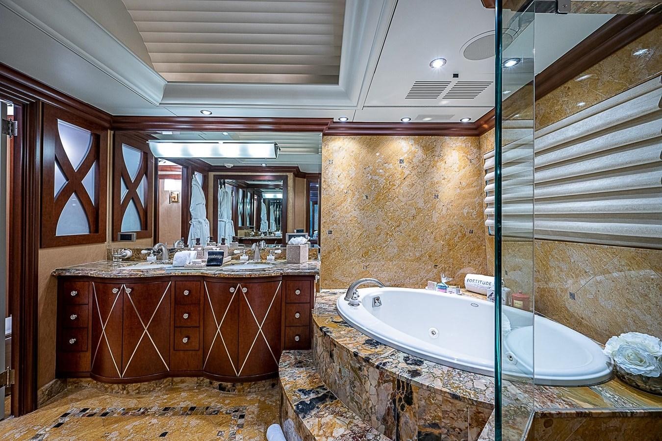 a bathroom with a large tub aboard LAGNIAPPE Yacht for Sale