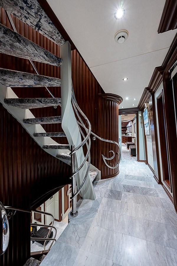 a staircase with a metal railing aboard LAGNIAPPE Yacht for Sale