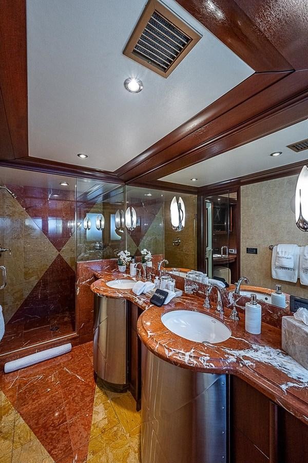 a bathroom with a large mirror aboard LAGNIAPPE Yacht for Sale