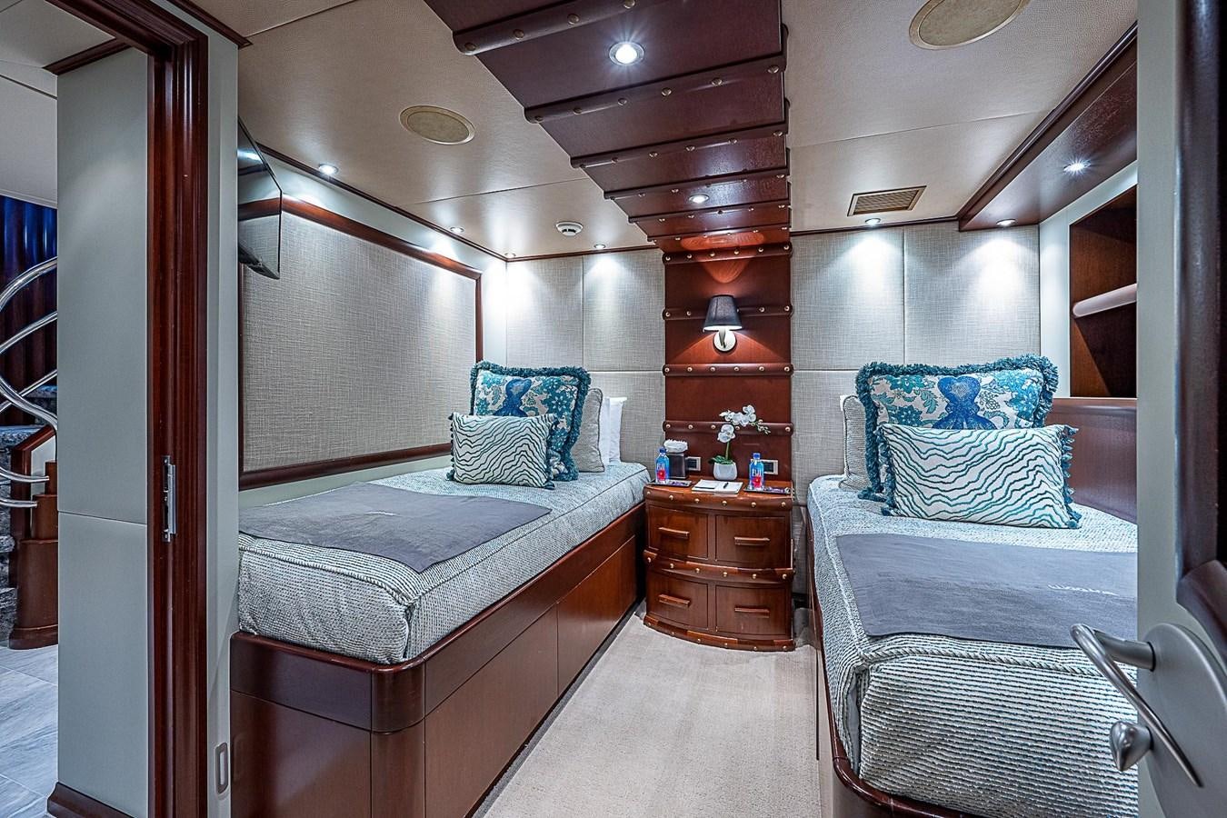 a room with a bed and a wood shelf aboard LAGNIAPPE Yacht for Sale