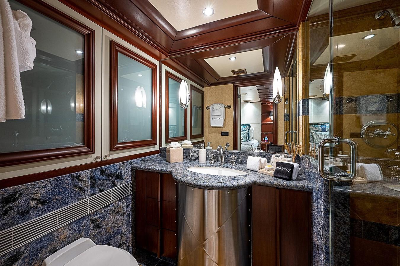 a bathroom with a large mirror aboard LAGNIAPPE Yacht for Sale