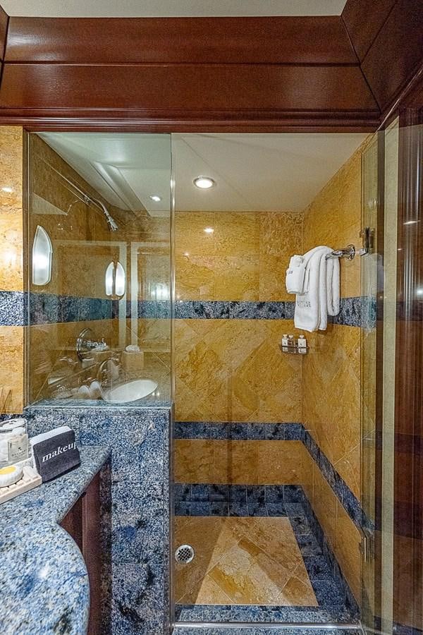 a bathroom with a large mirror aboard LAGNIAPPE Yacht for Sale