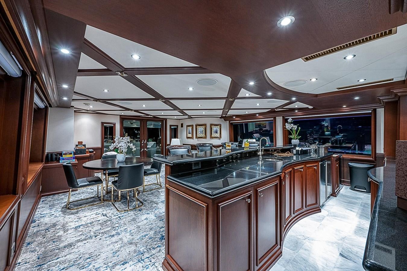 a kitchen with a large island aboard LAGNIAPPE Yacht for Sale